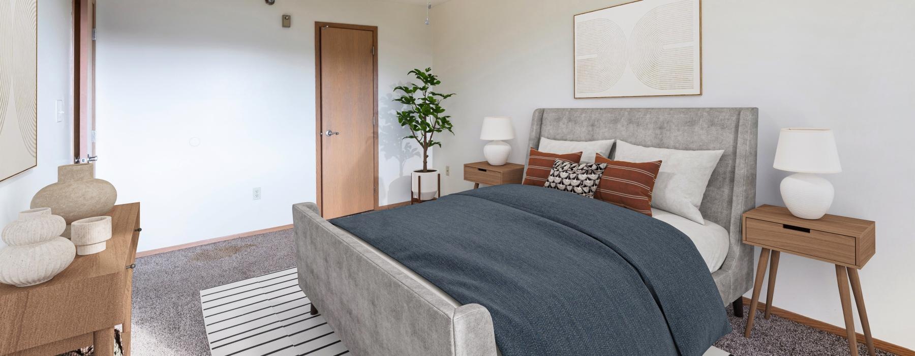 a bedroom with a bed and a fan